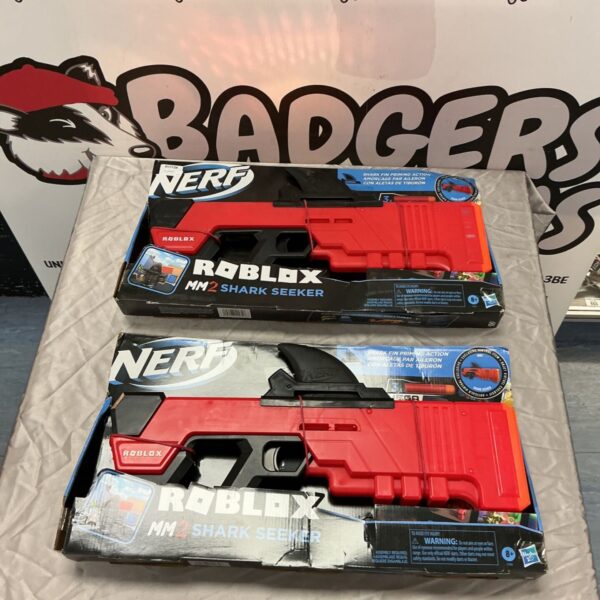Two boxed Nerf Roblox MM2 Shark Seeker red toy blasters on a grey surface