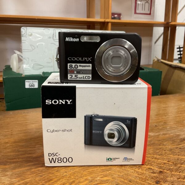 Nikon Coolpix S210 camera on Sony DSC-W800 box at auction