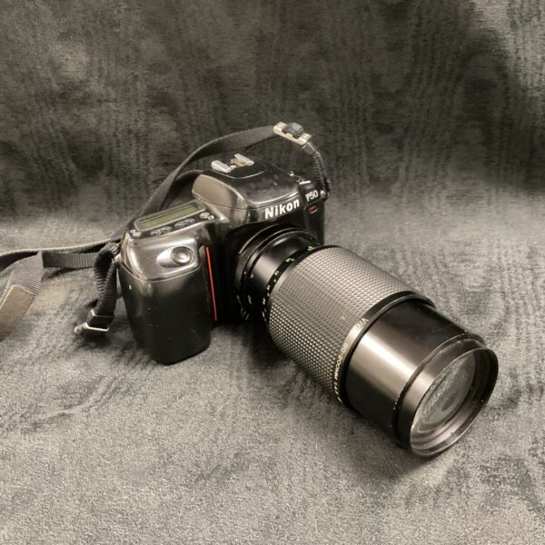 Nikon F50 SLR camera with Vivitar 80-200mm lens, vintage film photography.
