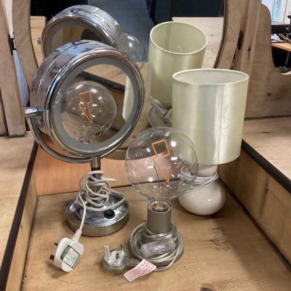 No7 light up makeup mirror beside two cream table lamps with ceramic bases