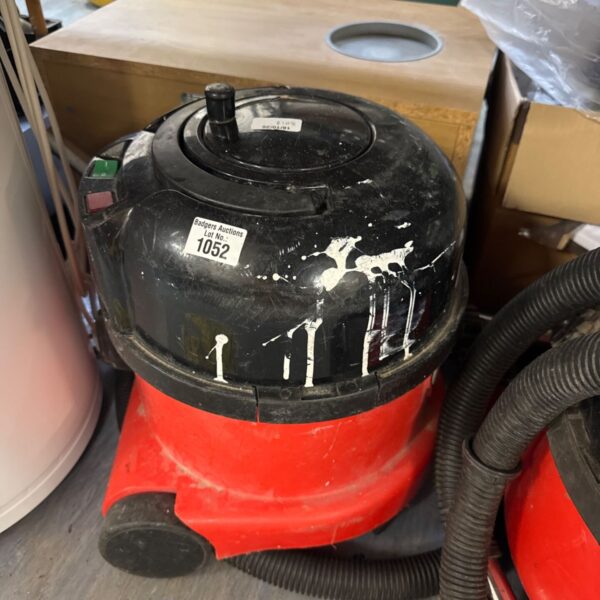Red Numatic Henry Hoover cylinder vacuum cleaner.