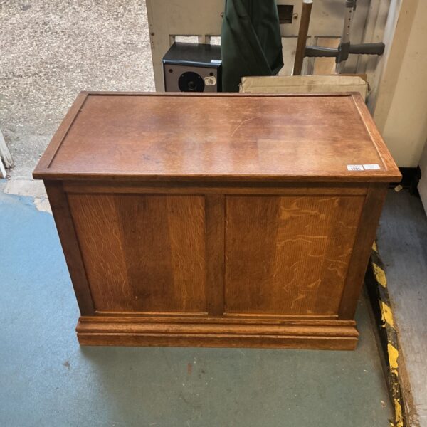 Vintage oak blanket chest with lift-top lid and panelled front.