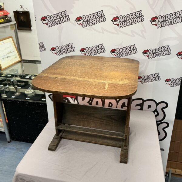 Antique oak drop leaf table with magazine rack, a charming hall table.