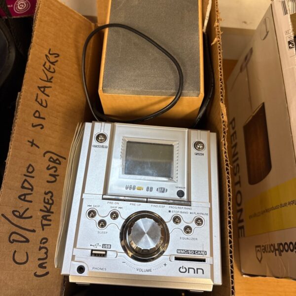 Onn micro hi-fi system with speakers, showing front panel controls.