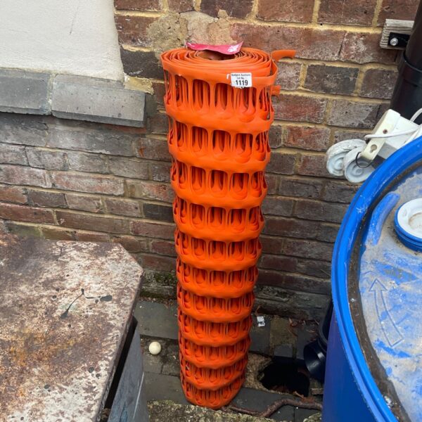 Roll of bright orange temporary plastic fencing for safety and barriers.