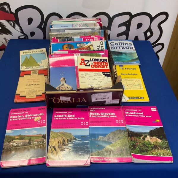Large collection of Ordnance Survey maps and vintage travel guides.