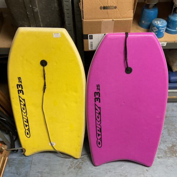 Yellow and pink Osprey 33.25" bodyboards standing side by side with leashes