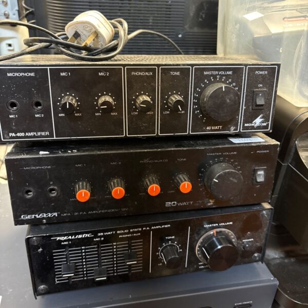 Three stacked PA amplifiers by Monacor, Genexxa and Realistic