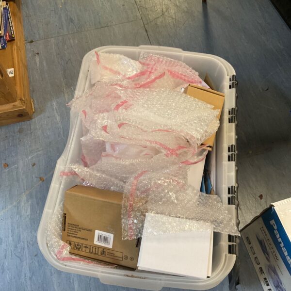 Mixed lot of packaging supplies including boxes and plastic bags.