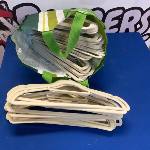 Large lot of vintage padded coat hangers for clothing storage.