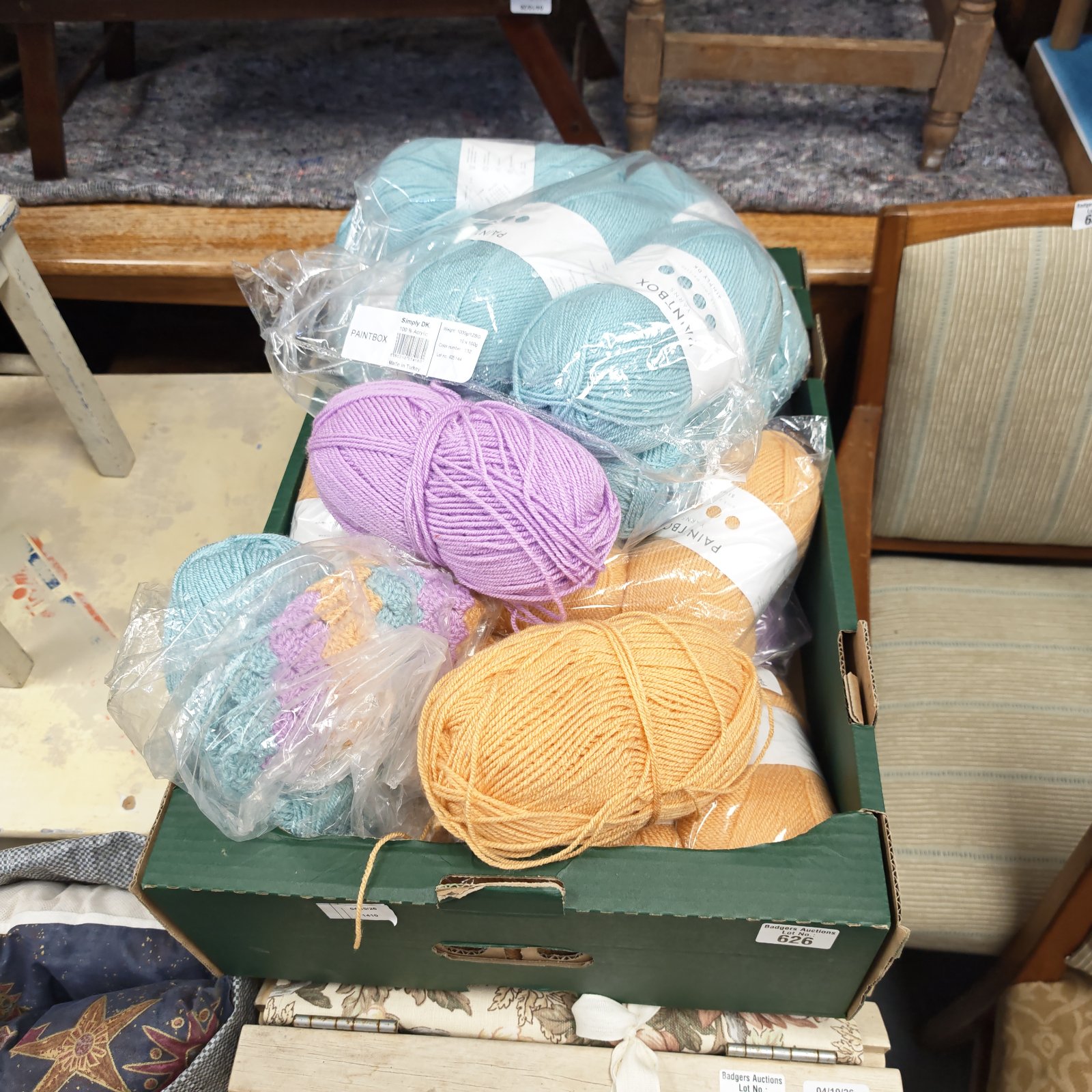Tray of multicoloured Paintbox wool for knitting and crochet projects.