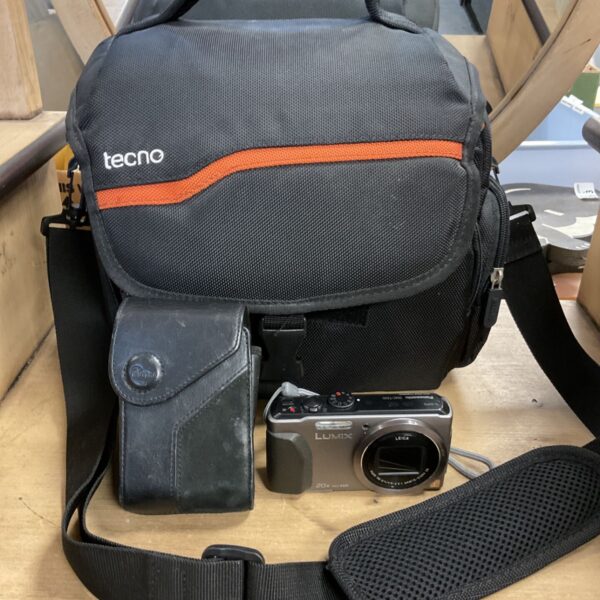 Panasonic Lumix DMC-TZ40 digital camera beside black Tecno camera bag