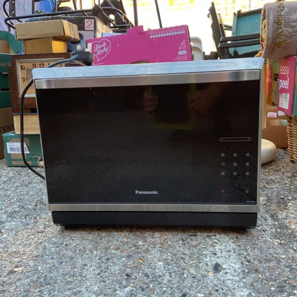 Vintage Panasonic tabletop microwave oven in used condition.