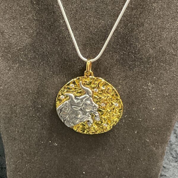 Pandora Taurus zodiac talisman pendant with silver bull on gold textured medallion