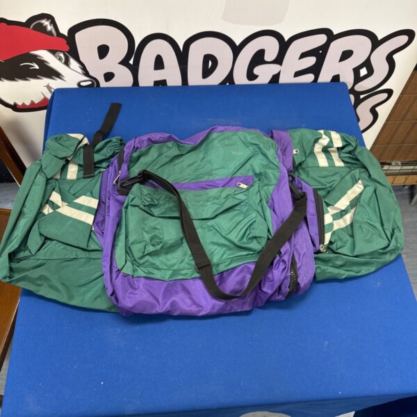 Green and purple pannier bag set for bicycles, vintage style.