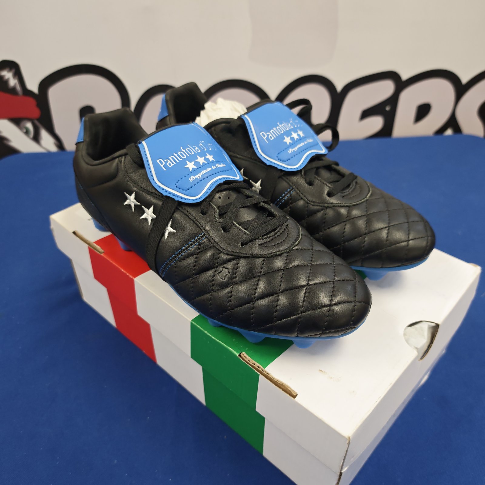 Black quilted leather Pantofola d'Oro football boots with blue accents on box