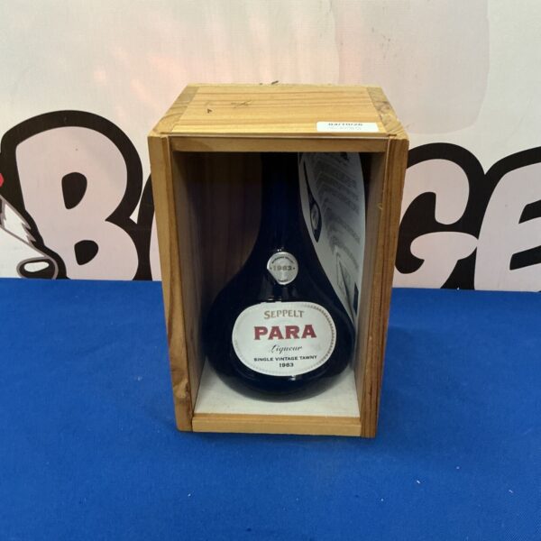 Vintage Para Liqueur bottle in display case, dated 1983.