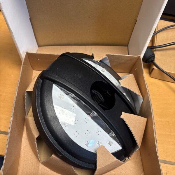 White parasol light disc in cardboard box.