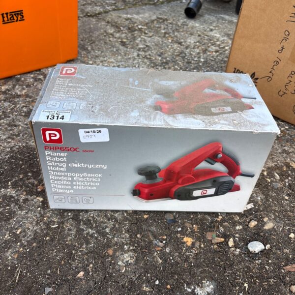 Boxed Performance Power 650W corded electric planer for woodworking.