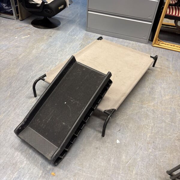 Folding pet ramp for easy access to elevated surfaces.