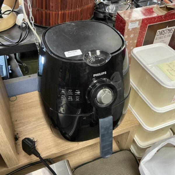 Black Philips air fryer with timer dial and printed cooking guide panel