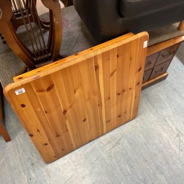 Solid pine table top with honey finish, rustic farmhouse style.