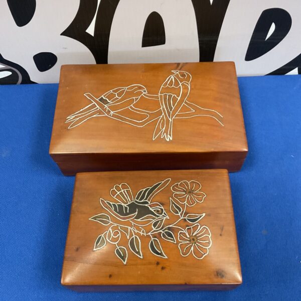 Vintage pine trinket boxes with hand-painted bird designs.