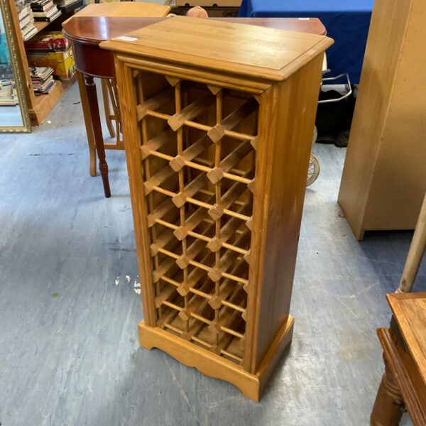 Solid pine wine rack for storing wine bottles, rustic home decor.