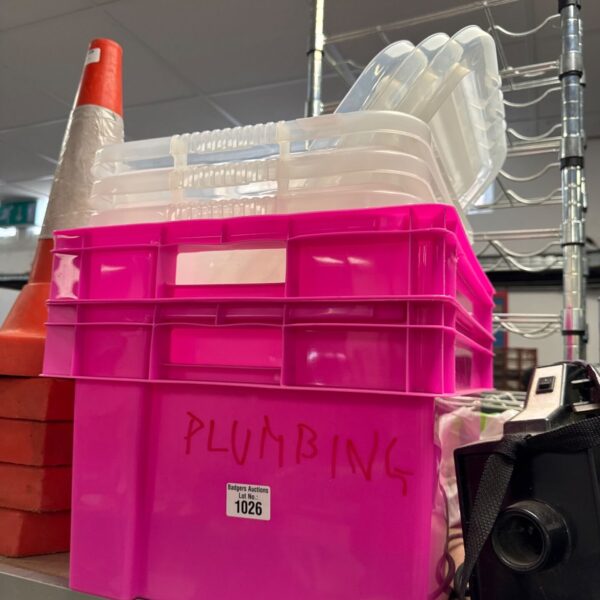Pink plastic storage boxes with lids, ideal for home organisation.