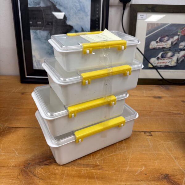 Vintage Pioneer food storage tubs with yellow lids.