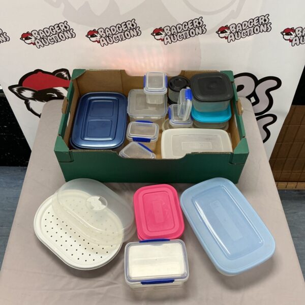 Assorted plastic food containers including Sistema brand for kitchen storage.