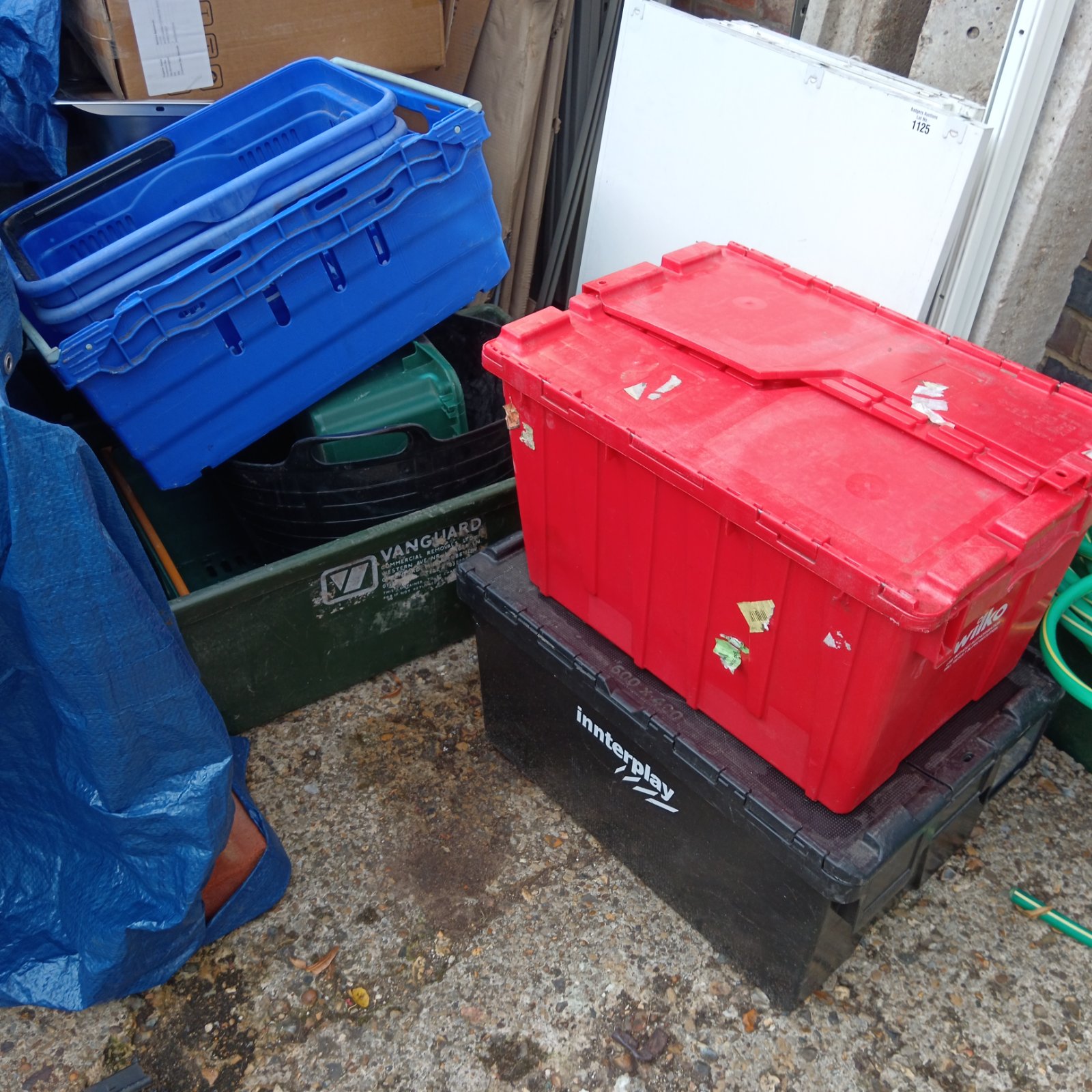 Lot of colourful plastic storage boxes for home or garden use.