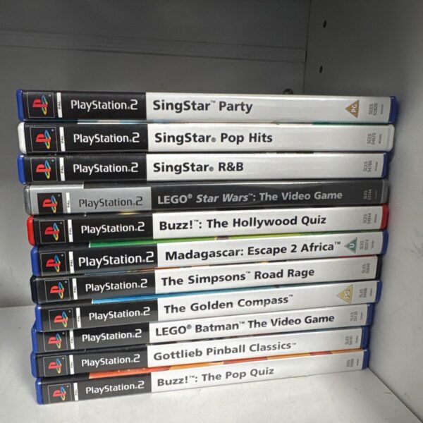 Eleven PlayStation 2 game cases stacked, including SingStar and LEGO titles