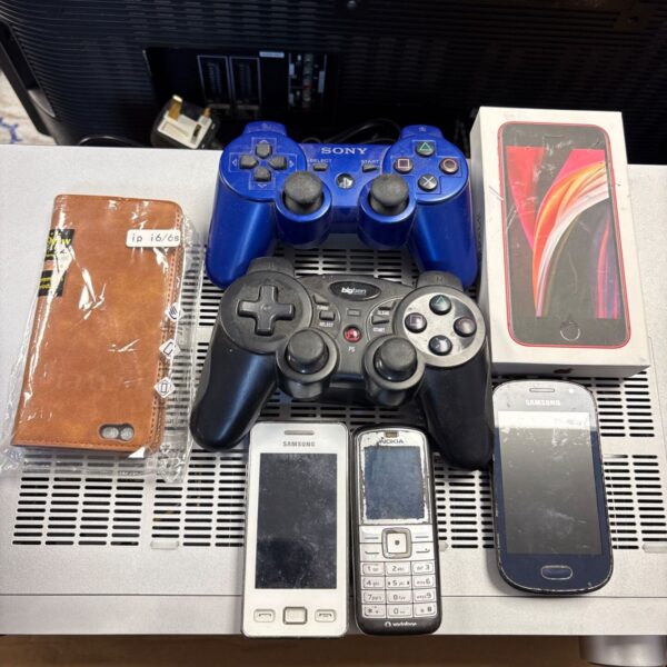 Sony PlayStation 3 controller with mixed lot items.