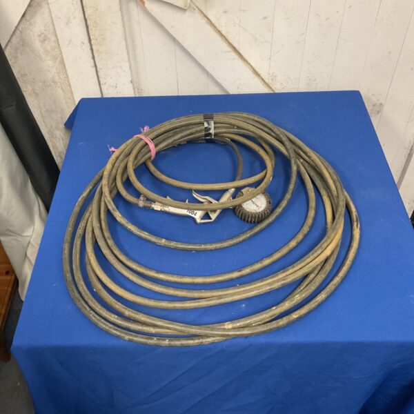 Coiled pneumatic air compressor hose with trigger blow gun and pressure gauge