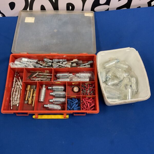 Red compartmentalised case of pneumatic air line fittings, brass hose barbs and crimp terminals