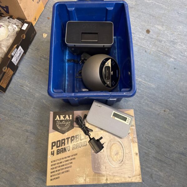Blue crate with docking station, JBL speaker, Sony radio and Akai radio box