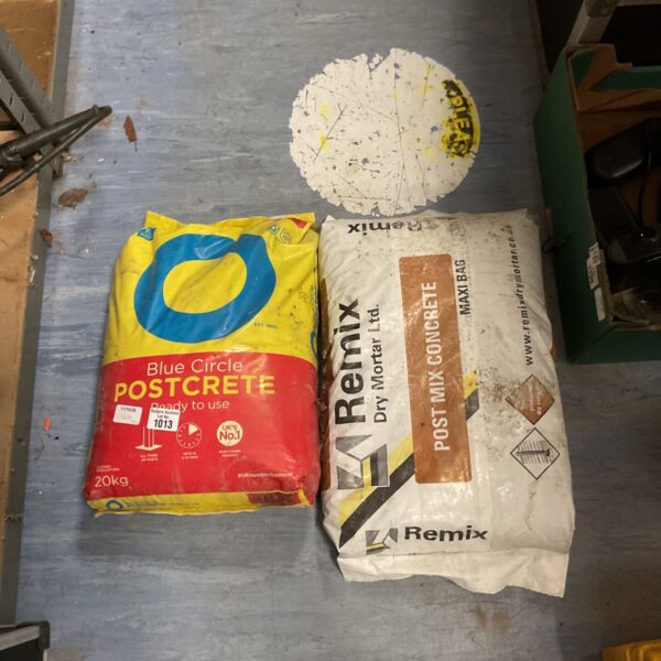 Two unopened 20kg bags of Postcrete cement for garden and DIY projects.