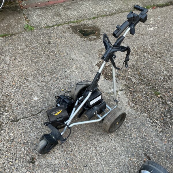 Side view of a used Powerkaddy electric golf trolley.