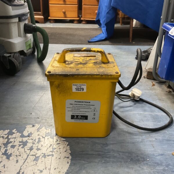 Yellow Powertran TR4 110V power transformer with carry handle and attached mains cable