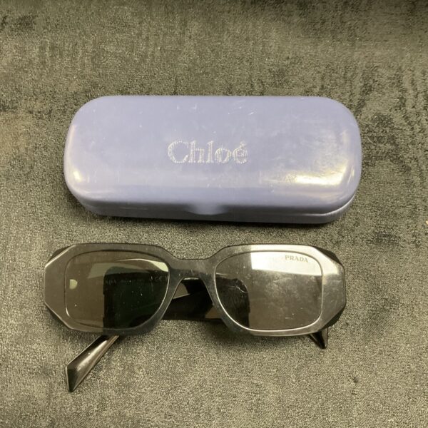 Vintage Prada sunglasses with a lavender Chloé case.