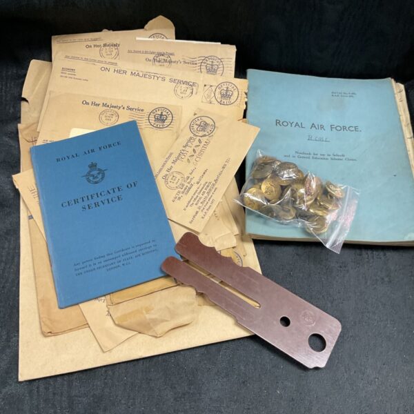 Pre 1953 RAF ephemera with envelopes, certificate, notebook, brass buttons and button stick