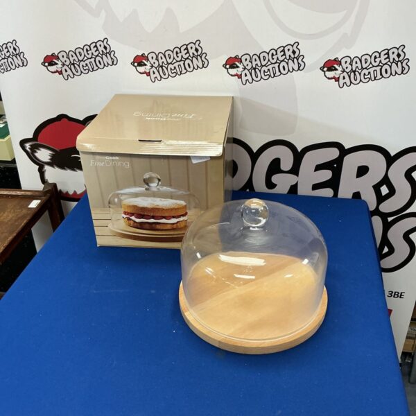 ProCook cake dome on a white surface, ideal for cake display.