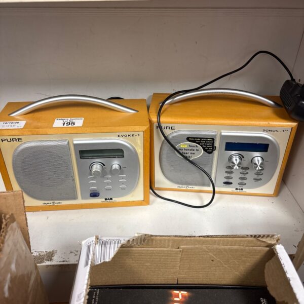 Two Pure radios, Evoke-1 and Sonus-1, presented for auction.