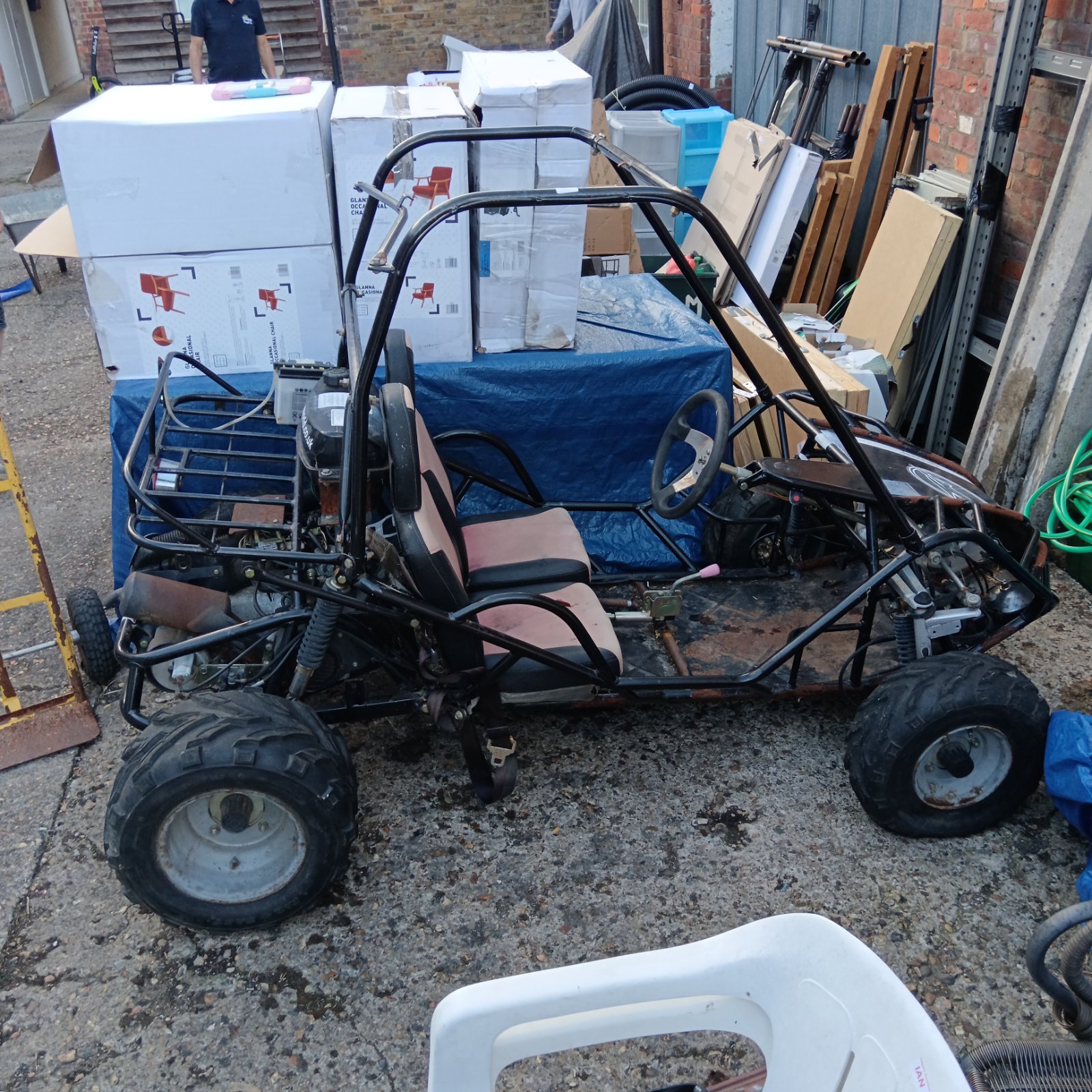 Side view of the Quadzilla petrol buggy showing its frame and tires.