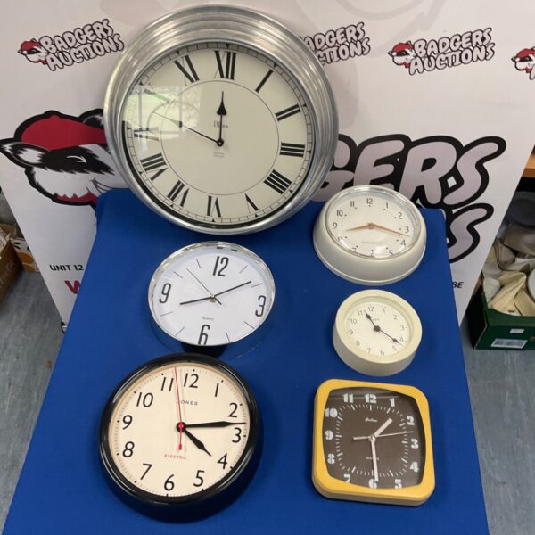 Selection of six quartz wall clocks including silver Bliss and black Jones clocks