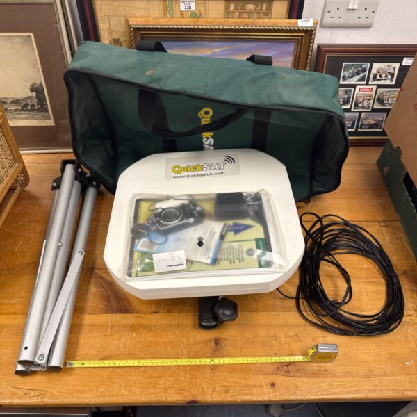 Quicksat satellite TV antenna set with carry bag and components.