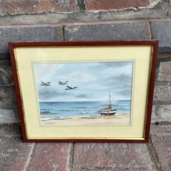 Framed R J Fursman watercolour of a sailing boat on a beach