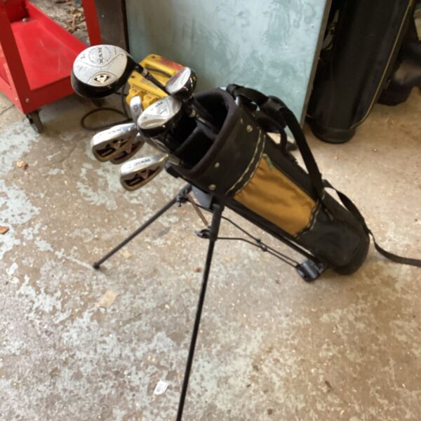 Set of Ram golf clubs with black and tan stand bag and tripod