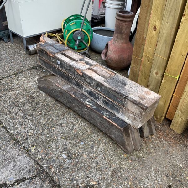 Three pieces of reclaimed timber planks for DIY projects.